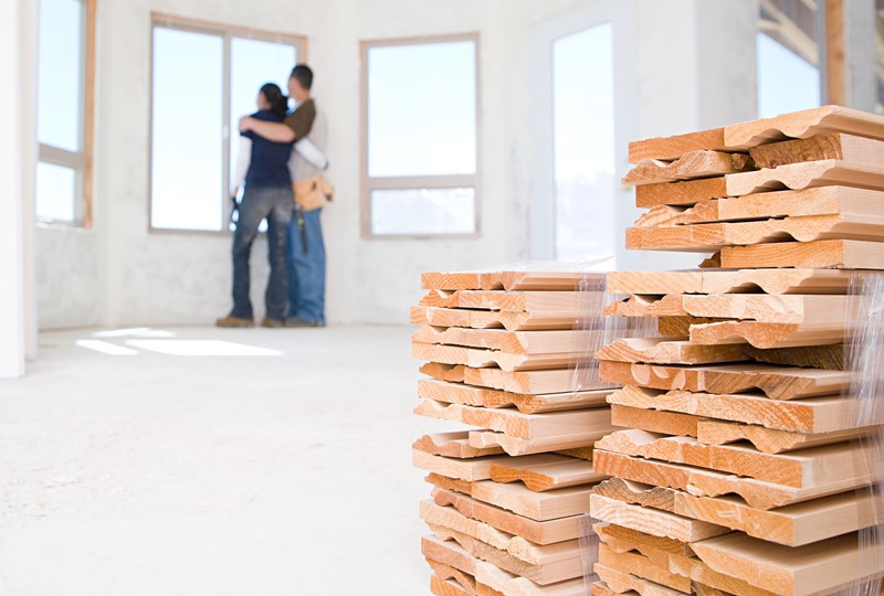 couple standing in a new construction home