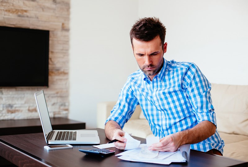 man going over financials at desk