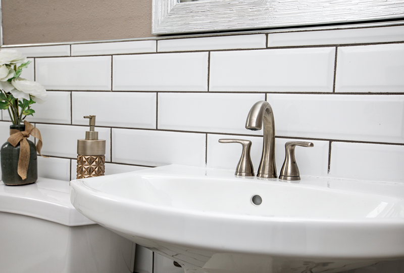 subway tile and pedestal sink