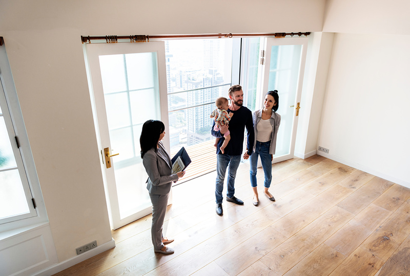 First-time condo buyers walking through a condo