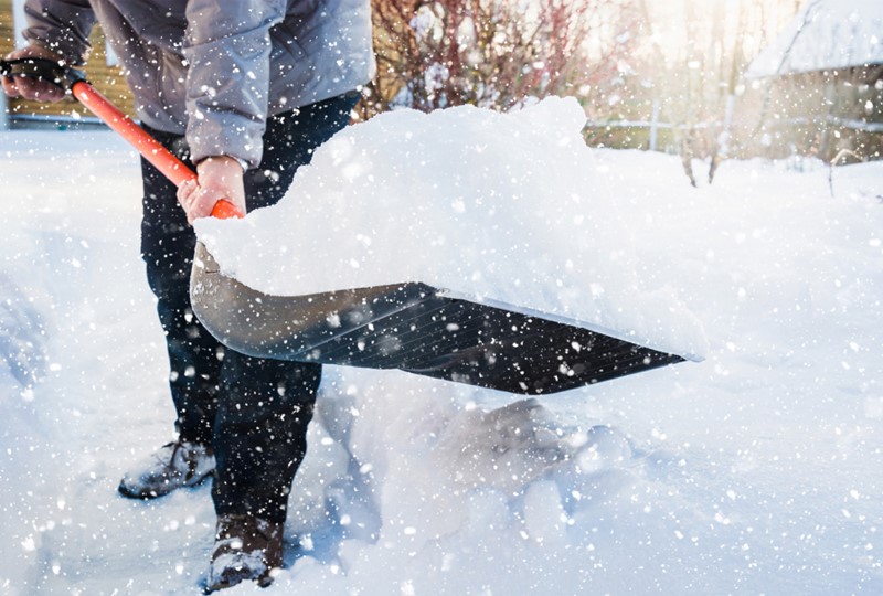 Shoveling city side walk