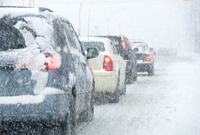 Cars driving through a blizzard