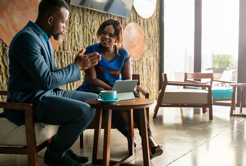 A real estate agent discussing home equity with a prospective seller