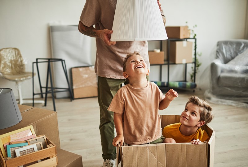 Kids playing in moving boxes